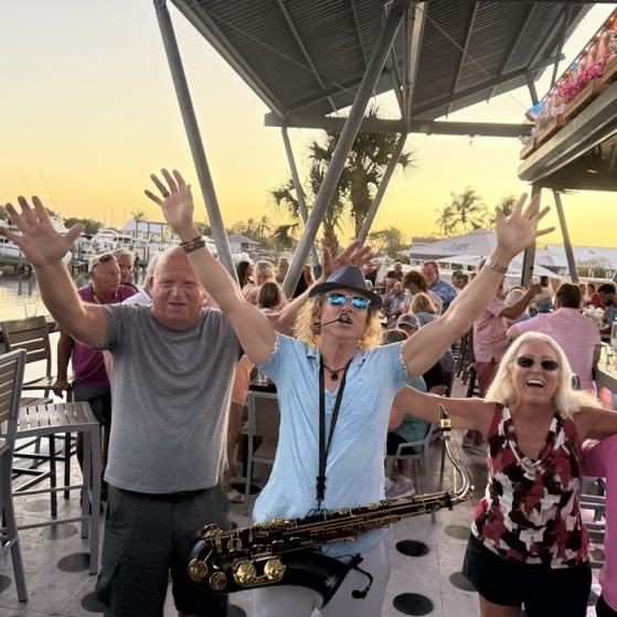 MattyB entertaining the audience with live sax at a Southwest Florida public show