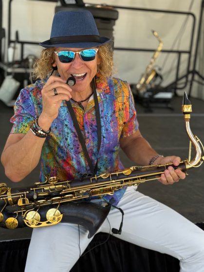 MattyB entertaining the audience with live sax at a Southwest Florida public show