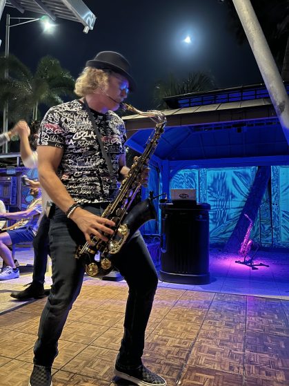 MattyB performing live saxophone at a public show in Southwest Florida