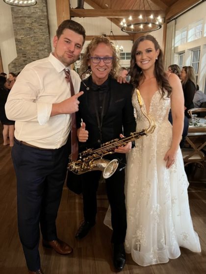 MattyB performing live saxophone during a wedding reception in Southwest Florida